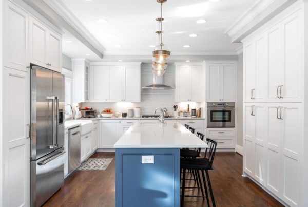 Kitchen remodel with white cabinets and blue kitchen island