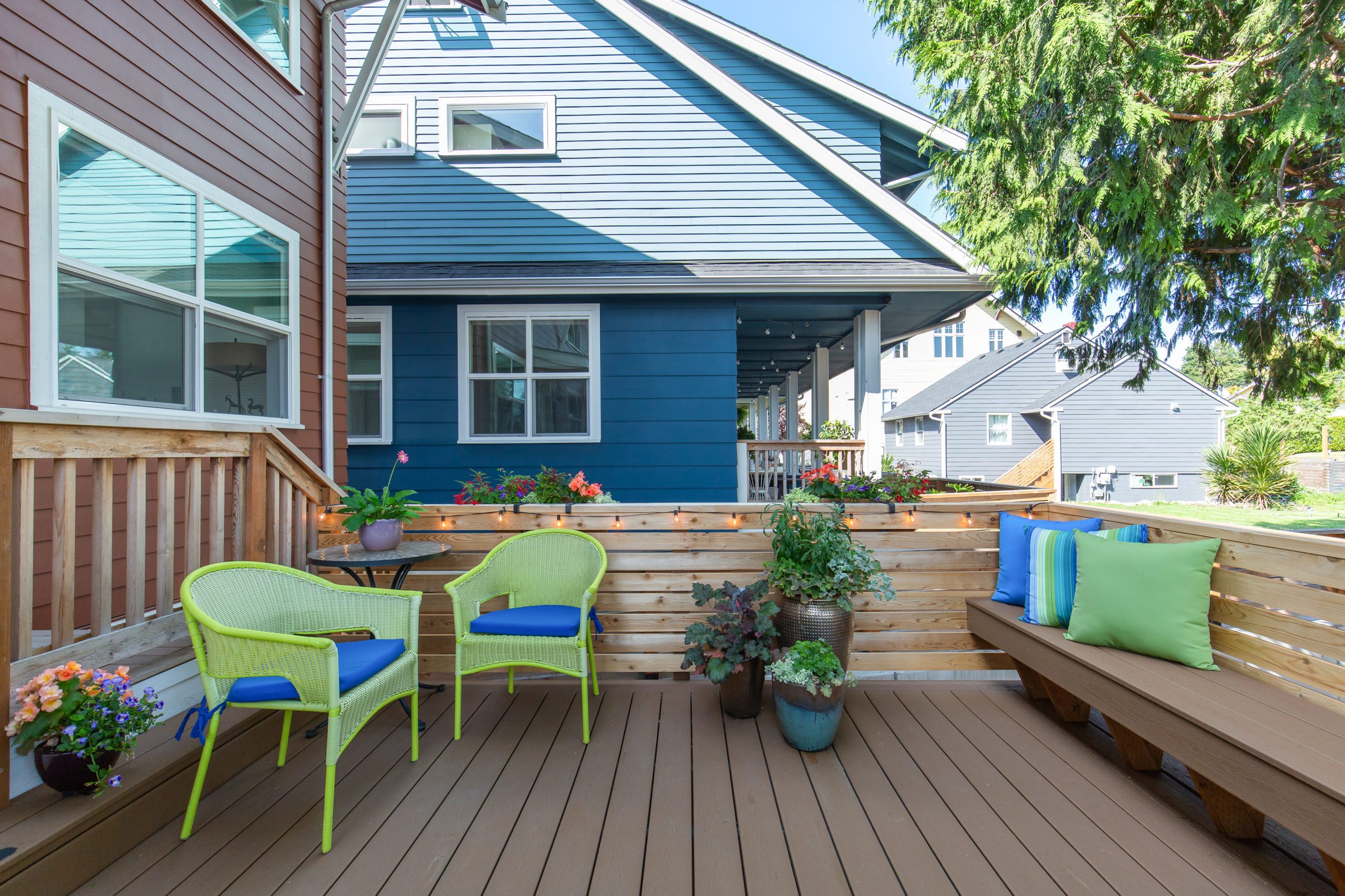 Backyard deck with bench seating and chairs