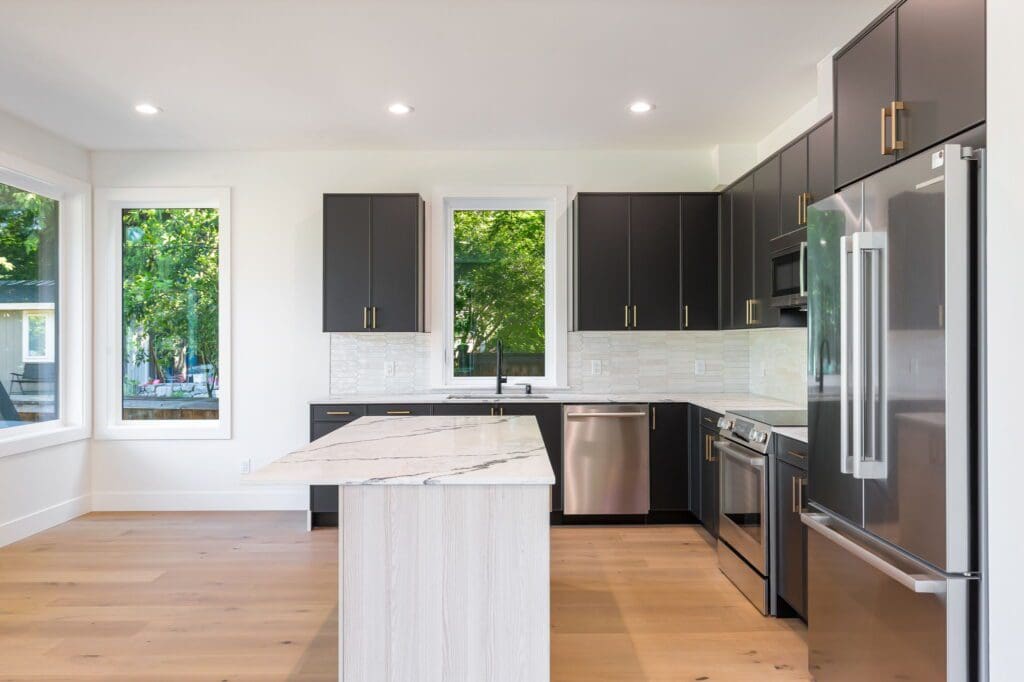 6733 46th Ave SW, Seattle WA_0013 Kitchen with center kitchen island in newly built seattle home.