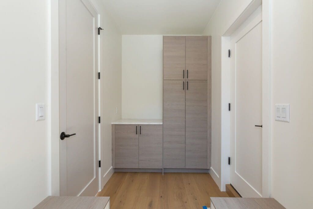 6733 46th Ave SW, Seattle WA_0049 Laundry room storage in Seattle new build.