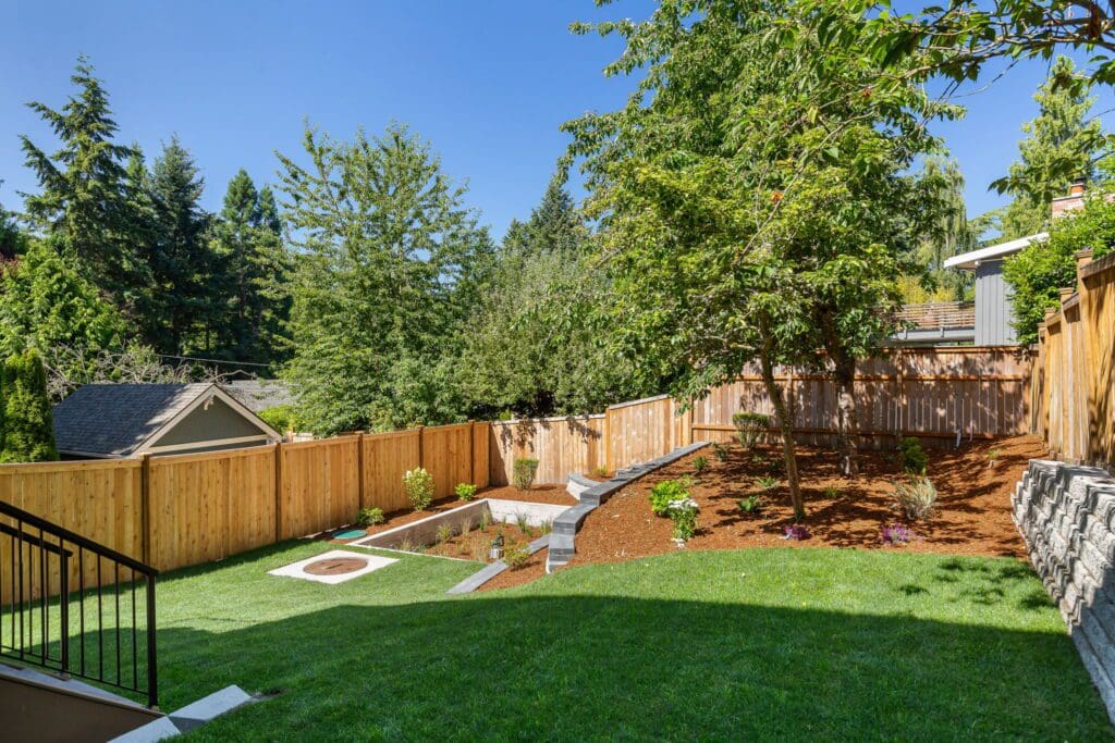 6733 46th Ave SW, Seattle WA_0055 Lawn and tired backyard landscaping design of Seattle home.