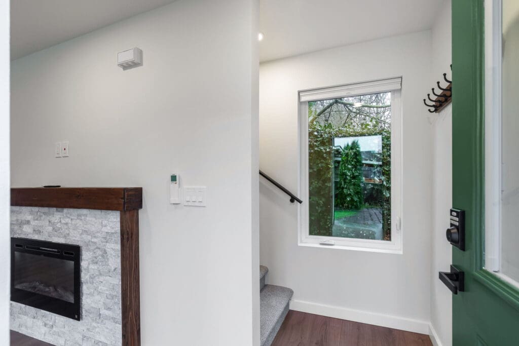 525 19th Ave, Seattle WA_0009 Door opening up to stairwell and window in two-story, 1,000 sq ft Seattle DADU