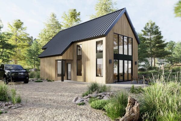 Modern wooden DADU with large vertical windows and a black metal roof. Surrounded by trees and greenery, a black SUV sits on the gravel driveway under a sunny sky.